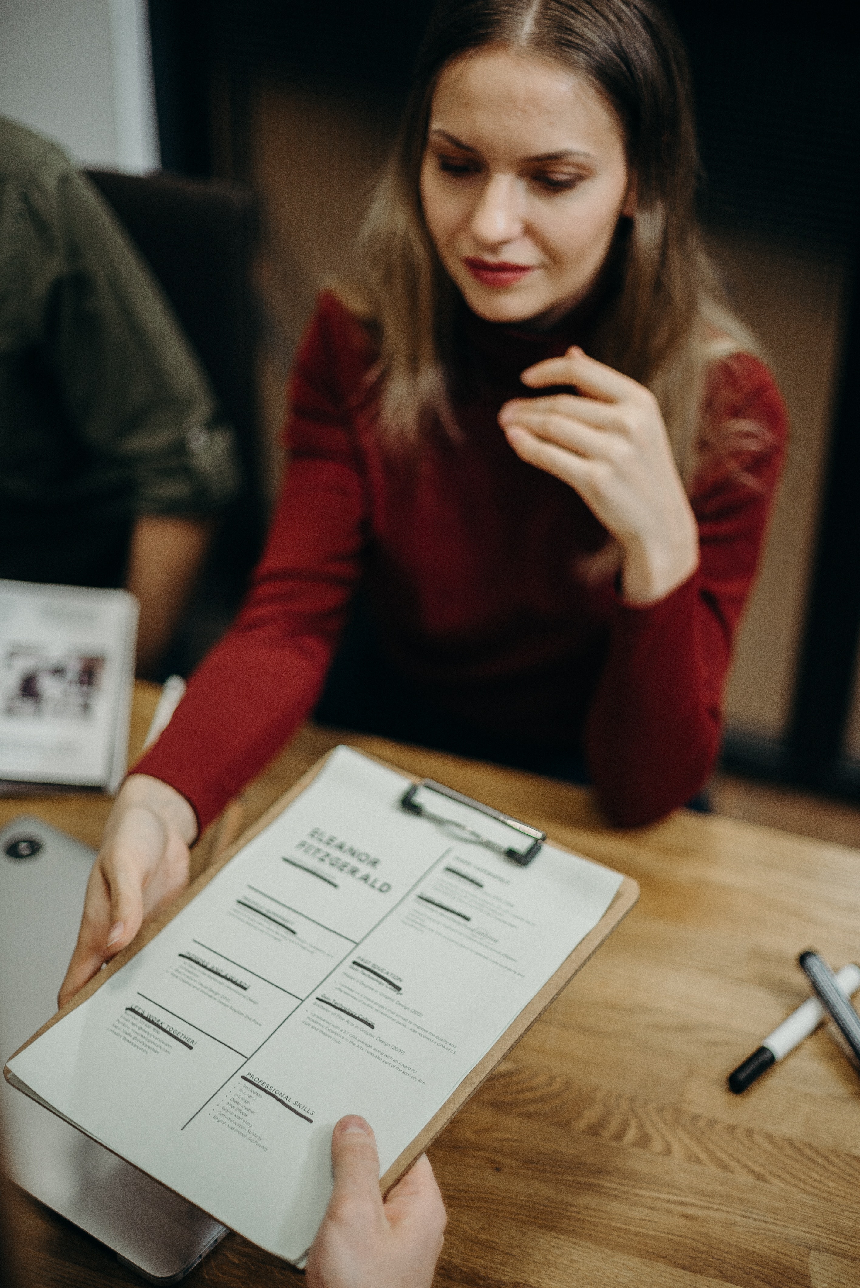 woman-holding-clipboard-3205566